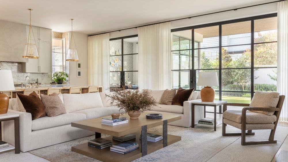 Luxury living room featuring marble walls and stone accents